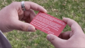 A College of the Canyons Constitutional rights card in the hands of a student